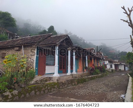 Mojokerto, Indonesia - March 29, 2019: One of the villages on the slopes of the penanggungan in a cool and foggy state, Indonesia March 29, 2019 Royalty-Free Stock Photo #1676404723