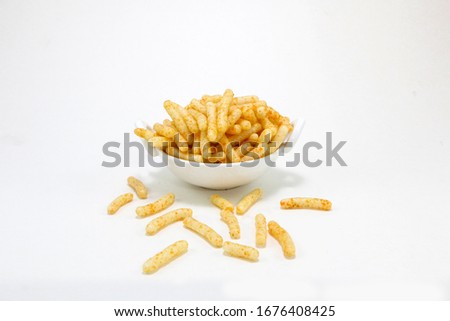 Fried and Spicy Stick, Sali Sev, noodles, Snacks or Fryums (Snacks Pellets) Royalty-Free Stock Photo #1676408425