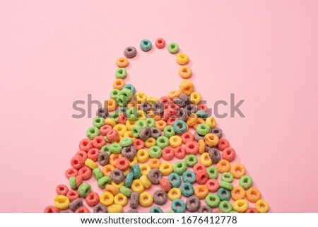 bright colorful breakfast cereal on pink background