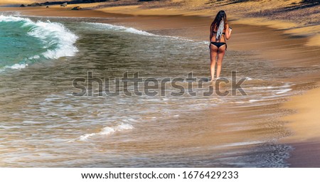 Tropical beach and clear sea Save the water - ecology concept background World Water Day. Woman in a Beach and bay sea shore of Mirissa.