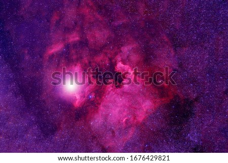 Beautiful pink cosmic nebula in deep space. Elements of this image were furnished by NASA.