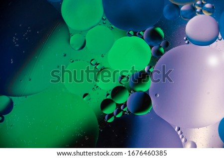Abstract color background with oil circles.  oil bubbles in water close-up.