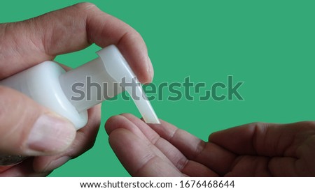 Green Screen Background Dispensing Hand Sanitizing Gel Into Hands
