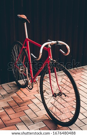 Fixed gear bicycle parked by the wall. Styled and toned photo for blog, music album pic