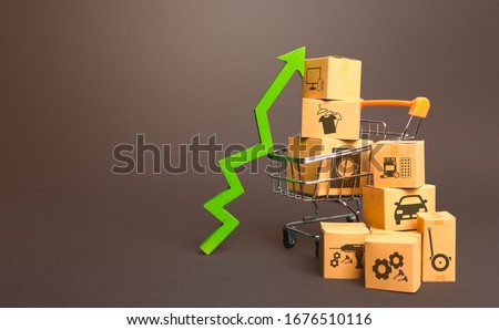 Shopping cart with boxes and green up arrow. Growth trade production, increased sales rate. Improving consumer sentiment. High demand for goods, retail merchandise. Excitement agiotage, rising prices. Royalty-Free Stock Photo #1676510116