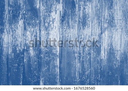 old rustic wooden background  toned in trendy color 2020 year classic blue.