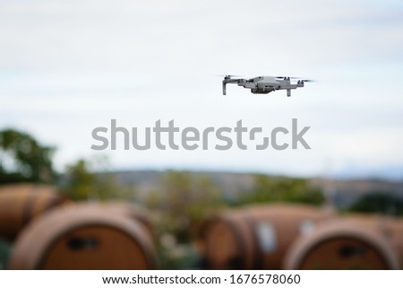 Drone overflying Tequila barrels in an agave field