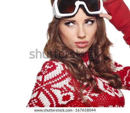 Portrait of a happy young girl snowboarding 
