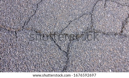 Cracked Black Road Textured Background