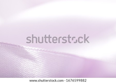 Abstract defocused purple satin ribbon for background