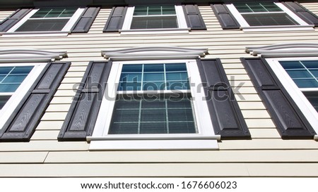 Six Windows on Apartment Building Backdrop