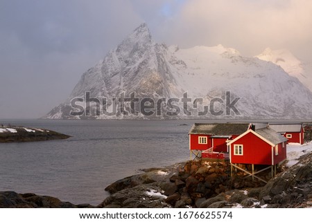 House in Norway against the mountains, Lofoten Islands, Norway