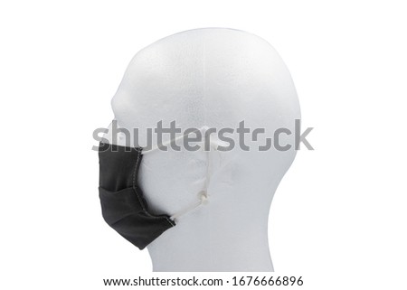 Black fabric mask with rubber ear straps. mask to cover the mouth and nose. 