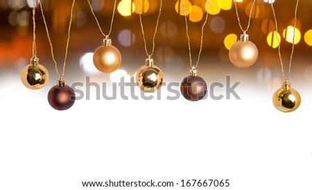 Christmas and New Year card decoration border with golden balls and light baubles