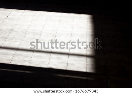 Shadows of windows on the floor.