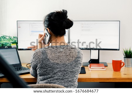 woman working at home. Office worker on quarantine. Home working to avoid virus disease. Freelancer or remote worker concept.  Royalty-Free Stock Photo #1676684677