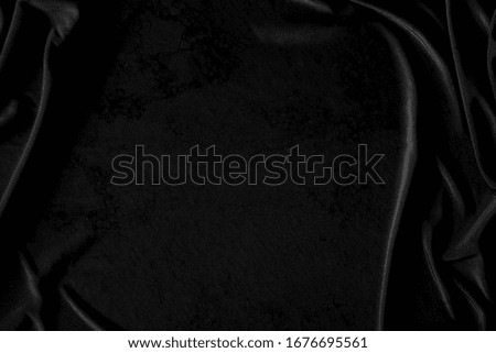 Black Dark gray luxury cloth abstract background. Detail fabric of pattern grunge silk texture satin velvet material, luxurious. Crumpled textile shiny black. Design, elegance with vignette effect.