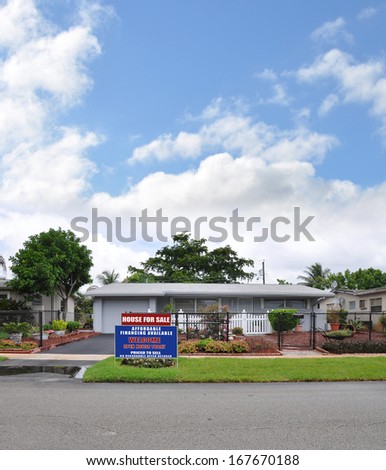 Real Estate For Sale Open House Welcome sign Front yard Lawn Landscaped Suburban home with plants flowers blue sky clouds USA Residential Neighborhood