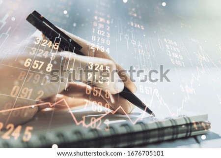 Abstract creative stats data concept with woman hand writing in notebook on background. Multiexposure