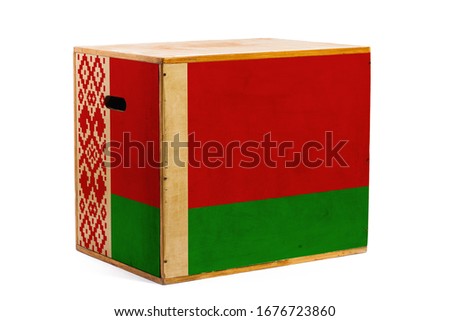 A wooden box for reliable shipment of various goods and cargo with the national flag of Belarus on a white isolated background. The concept of export-import and national delivery of goods. 