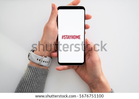 Quarantine and warning, attention, outbreak alert notification on mobile and smart watches devices. Stay at home advice to stop coronavirus COVID-19 spreading. Global pandemic Covid -19 prevention Royalty-Free Stock Photo #1676751100