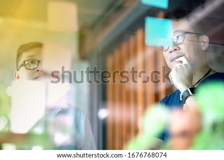 Asian business man team  wearing casual outfit meeting  with small business partner using note paper for present idea.Agile and scrum meeting Royalty-Free Stock Photo #1676768074