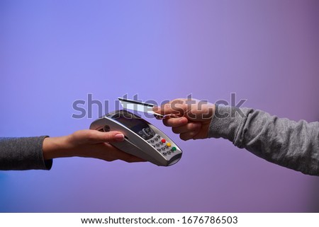 Payment by credit card via pin pad. Concept of shopping and online shopping Royalty-Free Stock Photo #1676786503