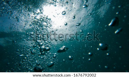 air Bubbles Underwater, Natural Under Water scene Royalty-Free Stock Photo #1676792002