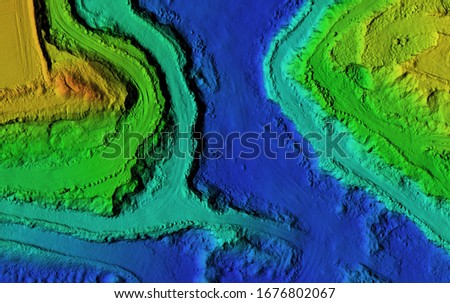 DEM - digital elevation model. GIS product made after proccesing aerial pictures. It shows excavation site with steep rock walls that was mapped from a drone Royalty-Free Stock Photo #1676802067