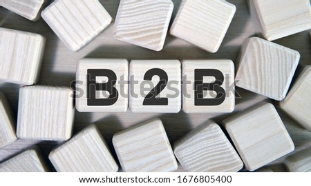 B2B - business concept. Wooden cubes and many cubes around