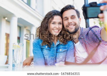 Portrait of man taking selfie with his beautiful girlfriend