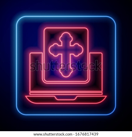 Glowing neon Cross on the laptop screen icon isolated on blue background.  Vector Illustration