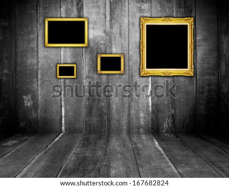 golden frame on wood background