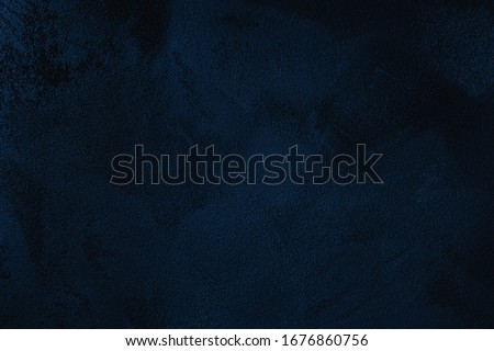Elegant navy blue colored dark Concrete textured cool grunge abstract background with roughness and irregularities. 2020 color trend concept.