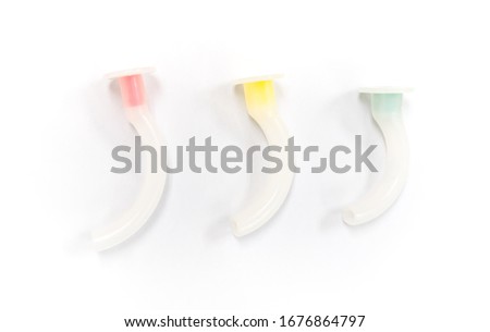 various size of oropharyngeal airways or oral airway for patient with compromised airway on the white background Royalty-Free Stock Photo #1676864797