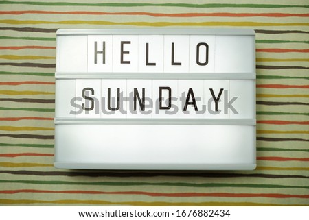 Top view Happy Sunday Text in Light box flat lay