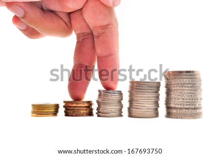 Growth concept. Fingers walking up on stacks of coins over white background