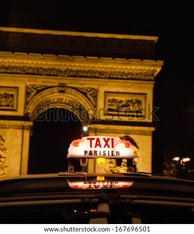 A Parisian taxi near Arc de Triomphe in Paris.