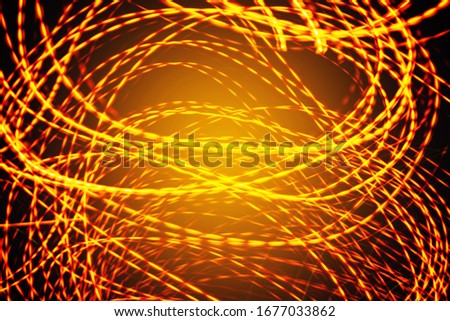 abstract background of flame- coloured stripes on a black background