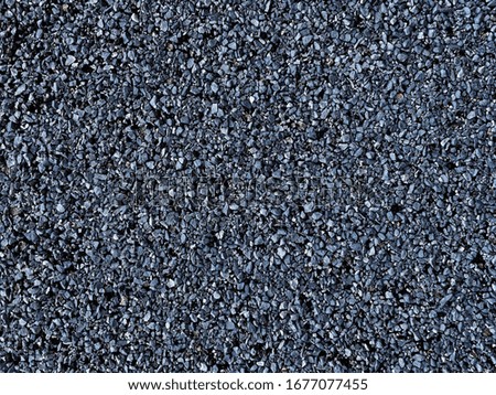Rough texture of asphalt crumb of blue-gray color. Pink rough wall. Background for website, poster, wallpaper, screen.