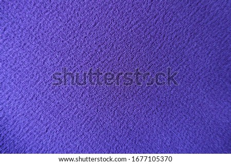 Background - simple purple polyester fabric from above
