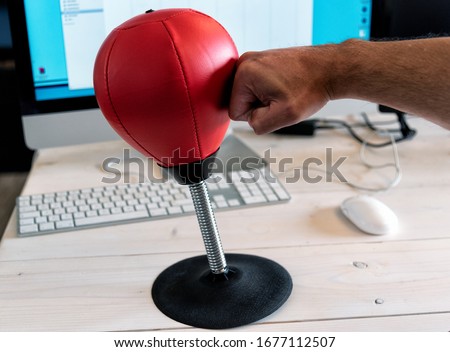 Red small punching ball in the office to reduce stress