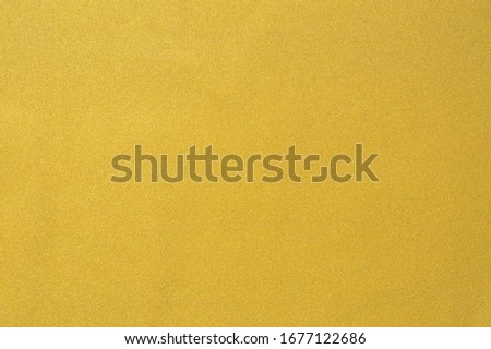 Luxery golden wallpaper background. Gold paper texture. Yellow glitter wall.