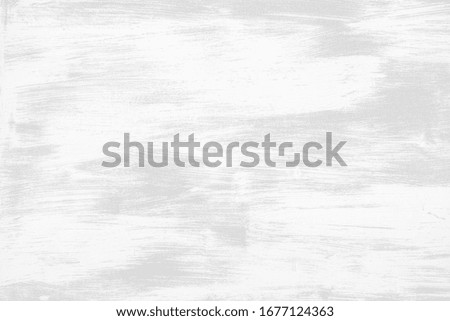 Wall texture of white brushed surface. Subtle light grey background of painted wall. Defocused image.
