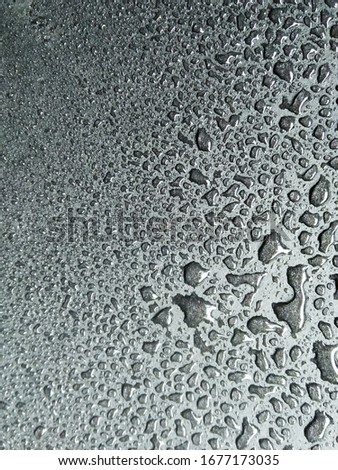 Water droplets on the black background
