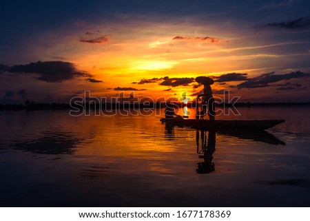 Pictures of life of the villagers using fish traps and a beautiful sunset in the Talung Kao Reservoir. Prakhon Chai District, Buriram Province Thailand.
