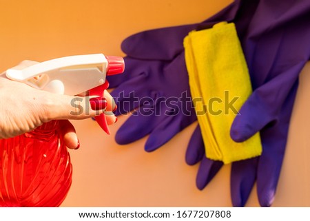 cleaning equipment, rubber gloves, cleaning cloths.Cleaning service concept. Early spring regular clean up.spray bottle with sterilizing solution make cleaning and disinfection for good hygiene. Royalty-Free Stock Photo #1677207808