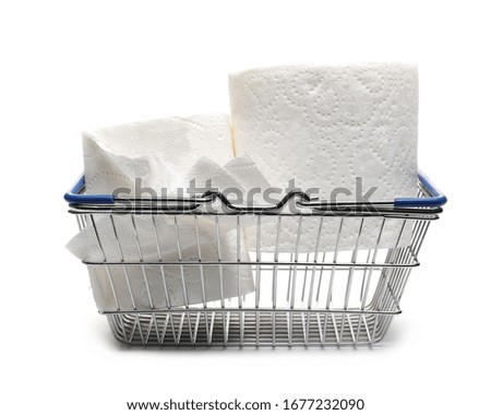 Toilet paper roll in shopping basket isolated on white background  