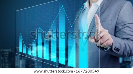 Businessman asian use hand show graph holographic statistics investment this year success to report investor for have enjoy  Royalty-Free Stock Photo #1677280549