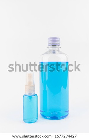 Ethyl alcohol bottle and spray.